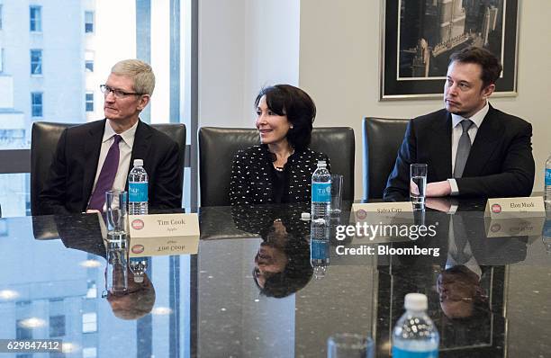 Tim Cook, chief executive officer of Apple Inc., from left, Safra Catz, co-chief executive officer of Oracle Corp., and Elon Musk, chief executive...