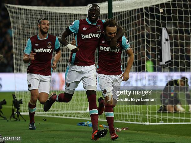 Mark Noble of West Ham United celebrates scoring his sides first goal with Cheikhou Kouyate of West Ham United during the Premier League match...