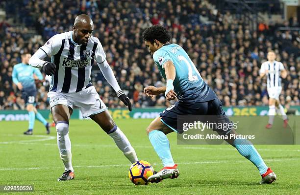 Jefferson Montero of Swansea City FC looks for a way past Allan Nyom of West Bromwich Albion during the Premier League match between West Bromwich...