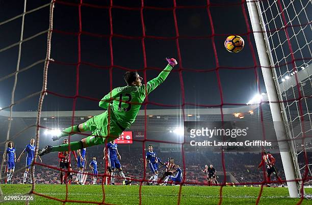 Thibaut Courtois of Chelsea saves a shot by Patrick van Aanholt of Sunderland during the Premier League match between Sunderland and Chelsea at...