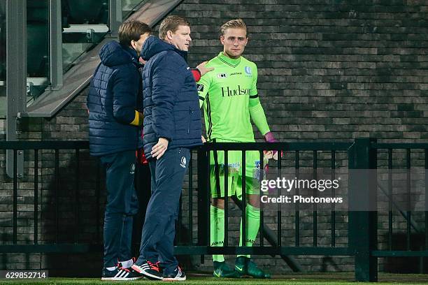 An injured Jacob Rinne goalkeeper of KAA Gent with Hein Vanhaezebrouck Headcoach of KAA Gent during the Croky Cup quarter final match between KV...