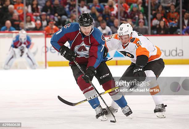 John Mitchell of the Colorado Avalanche skates against Roman Lyubimov of the Philadelphia Flyers at the Pepsi Center on December 14, 2016 in Denver,...