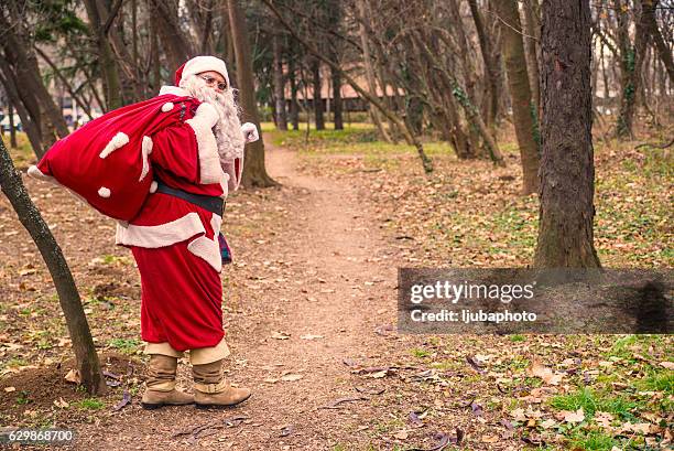 santa claus walking with the bag of the presents - pictures of containers seized by customs stock pictures, royalty-free photos & images