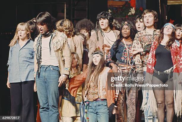 View of cast members performing on stage in the West End production of the musical stage show 'Hair' at the Shaftesbury Theatre in London, soon after...