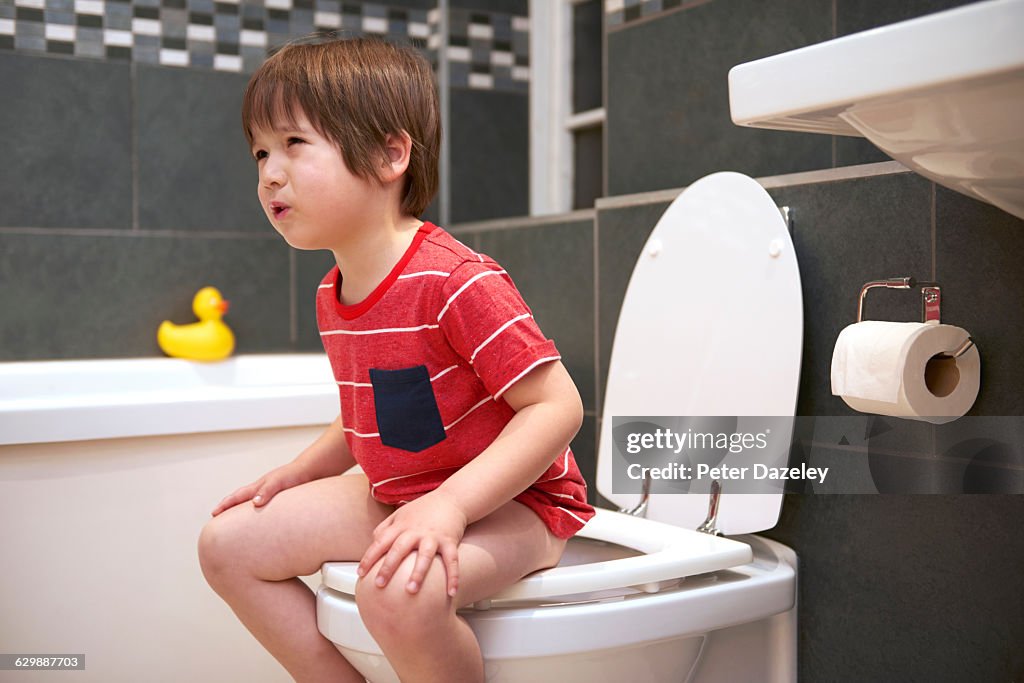 Four year old in pain on the toilet