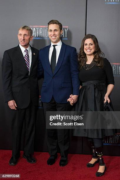 Boston Police Commissioner William Evans. Left, with Boston Marathon Bombing surviors Patrick Downes and Jessica Downes on the red carpet before the...