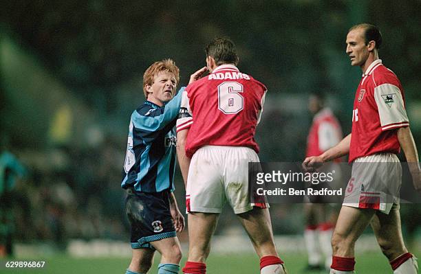 From left to right, midfielder Gordon Strachan of Coventry City, and defenders Tony Adams and Steve Bould of Arsenal, during an FA Carling...