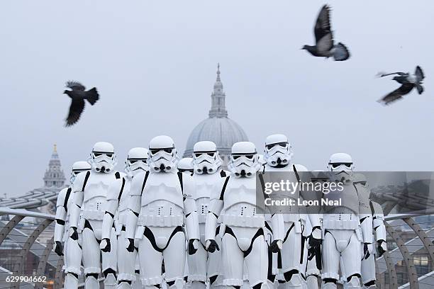 People dressed as Stormtroopers from the Star Wars franchise of films pose on the Millennium Bridge to promote the latest release in the series,...