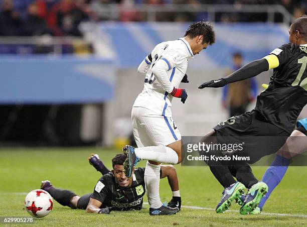 Yasushi Endo of J-League champions Kashima Antlers scores a goal with his heel during the second half of a Club World Cup semifinal against South...