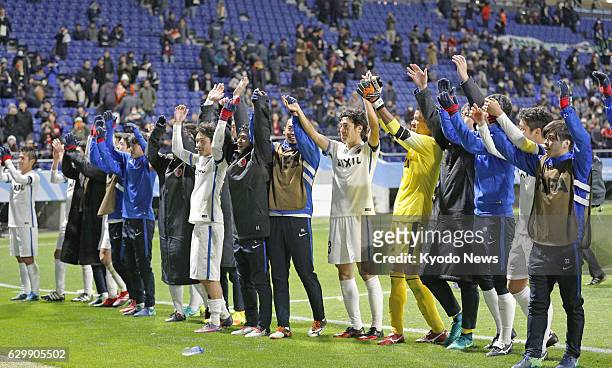 Players of J-League champions Kashima Antlers celebrate after defeating South American champions Atletico Nacional 3-0 in a Club World Cup semifinal...