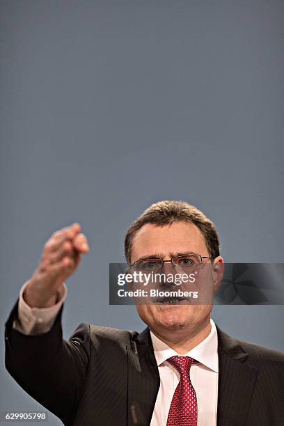 Thomas Jordan, president of the Swiss National Bank , gestures as he speaks during the bank's rate announcement news conference in Bern, Switzerland,...