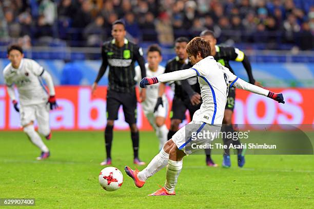 Shoma Doi of Kashima Antlers converts the penalty to score the opening goal during the FIFA Club World Cup Semi Final match between Atletico Nacional...