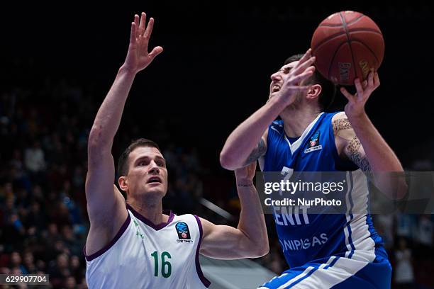 Nemanja Nedovic of Unicaja Malaga and Sergey Karasev of Zenit vie for the ball during the EuroCup Round 10 regular season basketball match between...