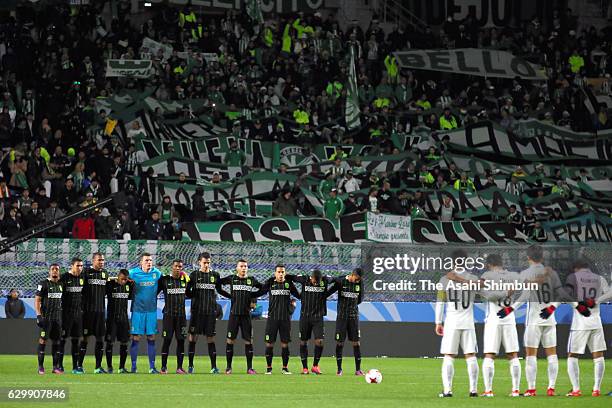 Players line up for a minute of silence in memory of the members of the Brazillian soccer team Chapecoense who were involved in the plane crash prior...