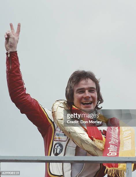 Barry Sheene of Great Britain, rider of the Heron Suzuki 500cc celebrates with a v for vicory salute after winning the German motorcycle Grand Prix...