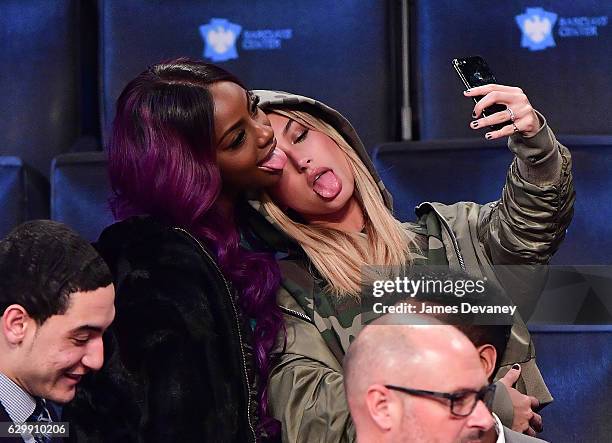 Hailey Baldwin and guest attend Brooklyn Nets vs Los Angeles Lakers game at Barclays Center on December 14, 2016 in New York City.