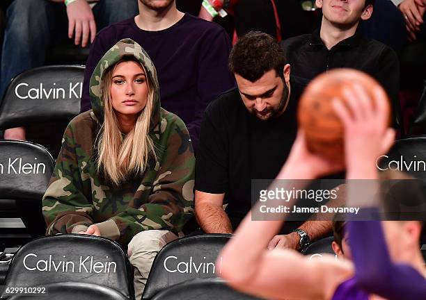 Hailey Baldwin and Zach Iser attend Brooklyn Nets vs Los Angeles Lakers game at Barclays Center on December 14, 2016 in New York City.