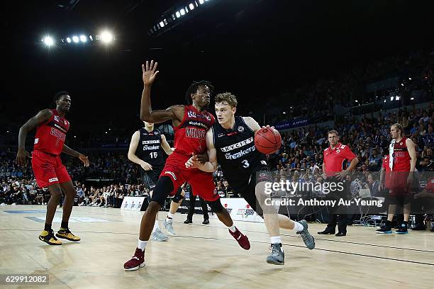 Finn Delany of the Breakers drives against Jaron Johnson of the Wildcats during the round 11 NBL match between New Zealand Breakers and Perth...