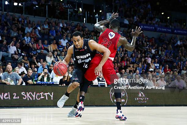 Mika Vukona of the Breakers drives around Casey Prather of the Wildcats during the round 11 NBL match between New Zealand Breakers and Perth Wildcats...