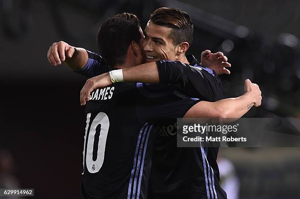 Cristiano Ronaldo of Real Madrid celebrates scoring a goal with James Rodriguez during the FIFA Club World Cup Japan semi-final match between Club...