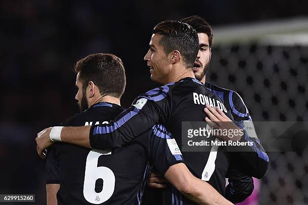 Cristiano Ronaldo of Real Madrid celebrates scoring a goal with team mates during the FIFA Club World Cup Japan semi-final match between Club America...