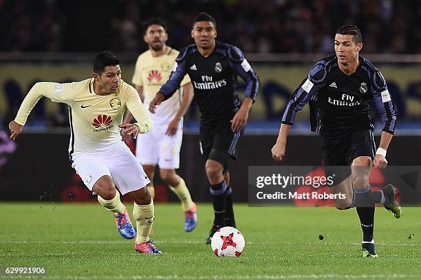 Cristiano Ronaldo of Real Madrid competes for the ball against Silvio Romero of Club America during the FIFA Club World Cup Japan semi-final match...