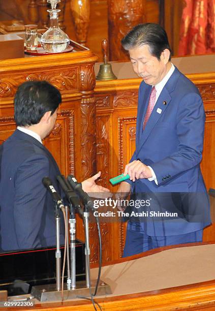 Ruling coalition Komeito leader Natsuo Yamaguchi votes against the bill at the plenary session of the Upper House at the diet building on December...