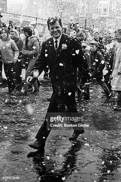 Undaunted by giant snowflakes, Senator Edward M. Kennedy marches in Southie's annual St. Patrick's Day parade in South Boston on March 17, 1964.