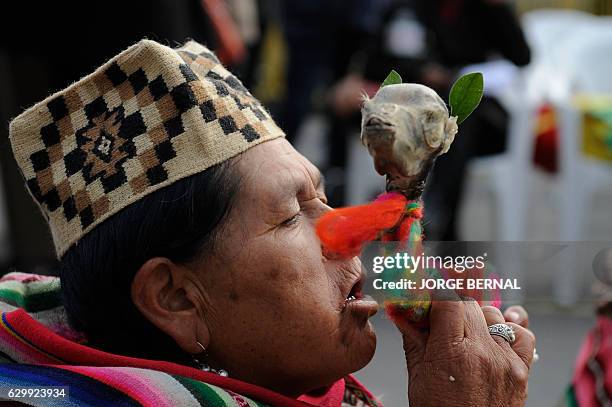 Amautas -Aymara priests- hold a traitional ritual to acknowledge Pachamama before the departure of the reed mace-handmade 18-meter long raft...