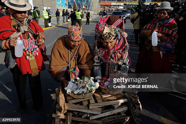 Amautas -Aymara priests- hold a traitional ritual to acknowledge Pachamama before the departure of the reed mace-handmade 18-meter long raft...