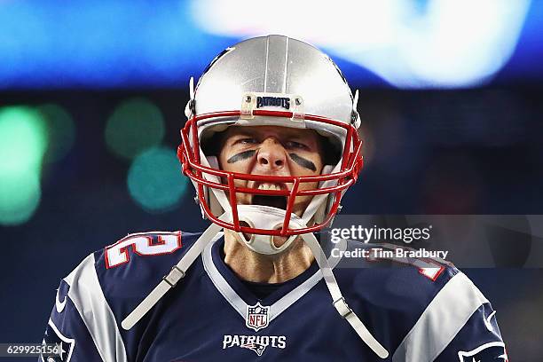 Tom Brady of the New England Patriots reacts as he runs on the field prior to the game against the Baltimore Ravens at Gillette Stadium on December...
