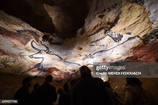 People visit the new replica of the Lascaux cave paintings, during the first public opening on December 15, 2016 in Montignac, in the Dordogne region...