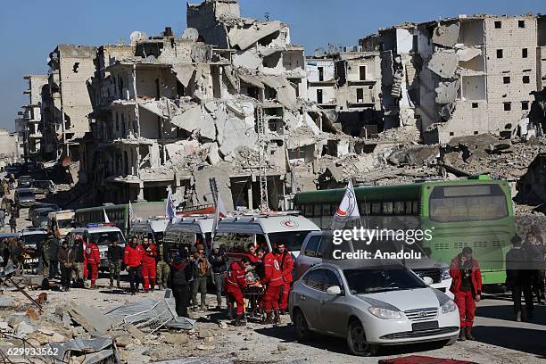 Convoy including busses and ambulances, wait at a crossing point at Amiriyah District of Aleppo Syria on December 15, 2016 to evacuate civilians,...