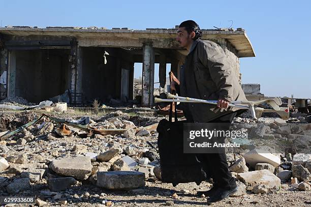 Convoy including busses and ambulances, wait at a crossing point at Amiriyah District of Aleppo Syria on December 15, 2016 to evacuate civilians,...