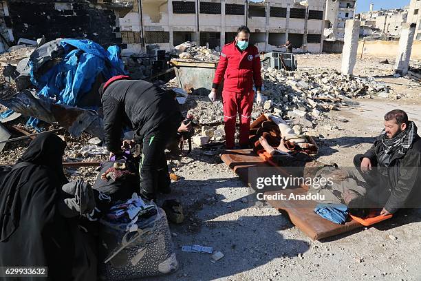 Convoy including busses and ambulances, wait at a crossing point at Amiriyah District of Aleppo Syria on December 15, 2016 to evacuate civilians,...