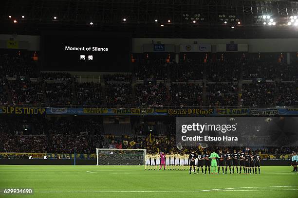 Fans, players and officials observe a minute of silence for the victims of the plane crash involving the Brazilian club Chapecoense prior to the FIFA...