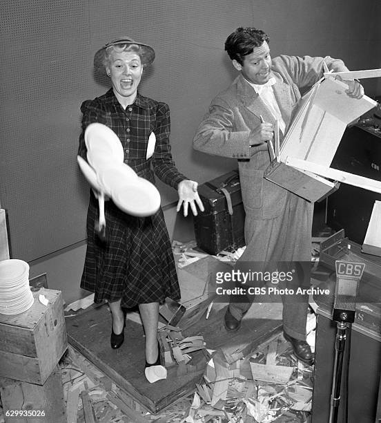The cast of the CBS Radio program Blondie featuring Penny Singleton and Arthur Lake . They smash wooden crates and boxes, to simulate the sound of...