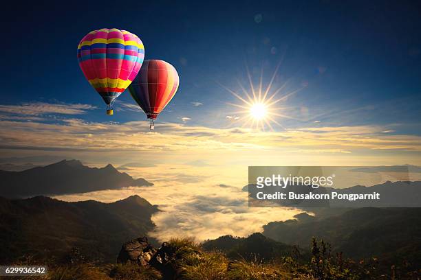 colorful hot-air balloons flying - hot air balloon ride stock pictures, royalty-free photos & images