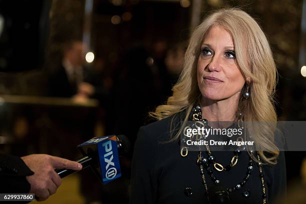 Republican political strategist Kellyanne Conway speaks with reporters in the lobby at Trump Tower, December 15, 2016 in New York City....