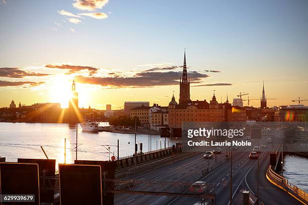 traffic on cetralbron and sunset over stockholm - centralbron stock pictures, royalty-free photos & images