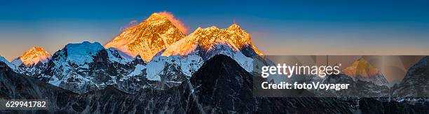 golden sunset on mt everest summit himalaya mountains peaks panorama - himalayas stock pictures, royalty-free photos & images