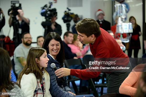 Boston Pops conductor Keith Lockhart sings with Grace and Mom during their annual holiday concert at Boston Children's Hospital December 15, 2016 in...