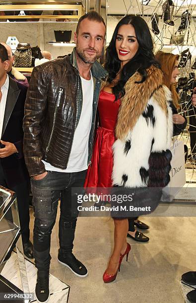 Philipp Plein and Andreea Sasu attend a cocktail party hosted by Philipp Plein to celebrate the opening of the Philipp Plein London boutique on...