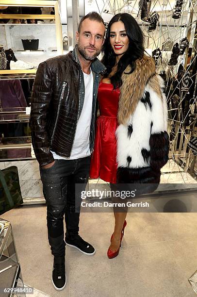 Philipp Plein and Andreea Sasu attend a cocktail party to celebrate the opening of the Philipp Plein London Boutique on December 15, 2016 in London,...