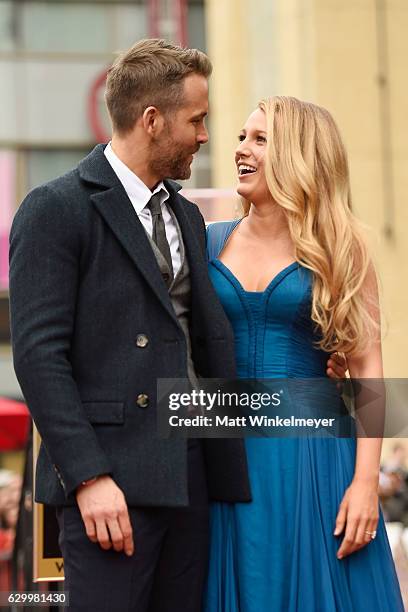 Actors Ryan Reynolds and Blake Lively pose for a photo as Ryan Reynolds is honored with star on the Hollywood Walk of Fame on December 15, 2016 in...