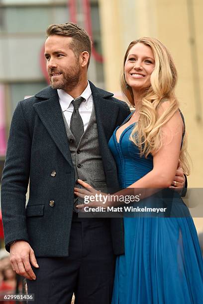 Actors Ryan Reynolds and Blake Lively pose for a photo as Ryan Reynolds is honored with star on the Hollywood Walk of Fame on December 15, 2016 in...