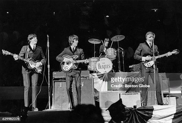 The Beatles play at Boston Garden in Boston on Sept. 12, 1964.