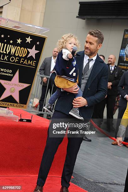 Actor Ryan Reynolds and daughter James Reynolds pose for a photo as Reynolds is honored with star on the Hollywood Walk of Fame on December 15, 2016...