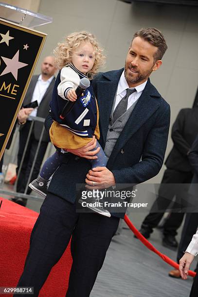 Actor Ryan Reynolds and daughter James Reynolds pose for a photo as Reynolds is honored with star on the Hollywood Walk of Fame on December 15, 2016...