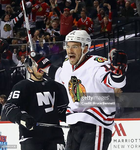 Artem Anisimov of the Chicago Blackhawks scores at 15:03 of the first period against the New York Islanders at the Barclays Center on December 15,...